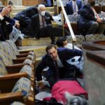 People shelter in the House gallery as rioters try to break into the House Chamber at the Capitol on 6 January. Trump’s impeachment trial will be held at the same place the violence unfolded.