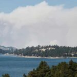 Smoke from the Caldor fire hovers over Caples Lake in Kirkwood, California.