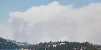Smoke from the Caldor fire hovers over Caples Lake in Kirkwood, California.