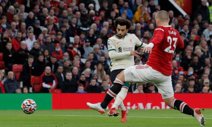 Mo Salah scores his second and Liverpool’s fourth goal in their 5-0 humiliation of Manchester United at Old Trafford.