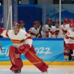 Team China goalkeeper Jeremy Smith (45) leads his team onto the ice prior to their game against Team USA on Thursday.