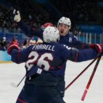 Team USA forward Noah Cates (27) celebrates with Sean Farrell (26) after scoring a goal against Team China during the second period during the Beijing 2022 Olympic Winter Games at National Indoor Stadium.