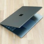 The Microsoft Surface Laptop Go 2 pictured half open on a table.