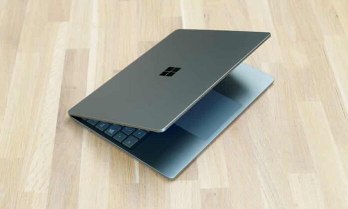 The Microsoft Surface Laptop Go 2 pictured half open on a table.