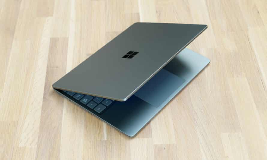 The Microsoft Surface Laptop Go 2 pictured half open on a table.