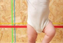 Baby in football boots