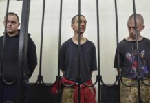 British man Shaun Pinner (R) and Moroccan Saaudun Brahim (C), pictured with Aiden Aslin (L) have reportedly appealed against their death sentences.