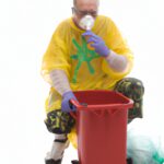 man cleaning waste