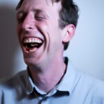 man with pale skin laughing