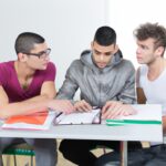 Three male students dscussing